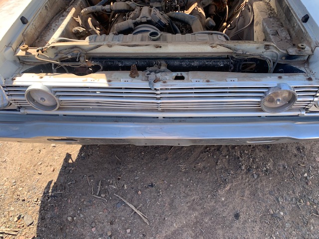 1966 Plymouth Belvedere complete grille assembly with headlight bezels and hood lip trim (#66PLBGHB)